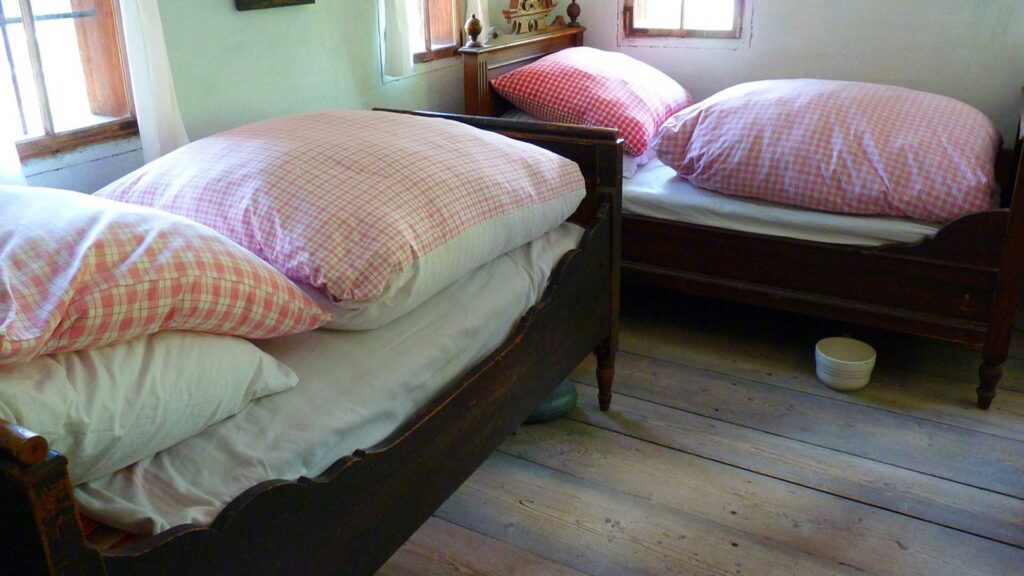 What were mattresses made of in the 1800s is that it used to be layered with featherbeds.