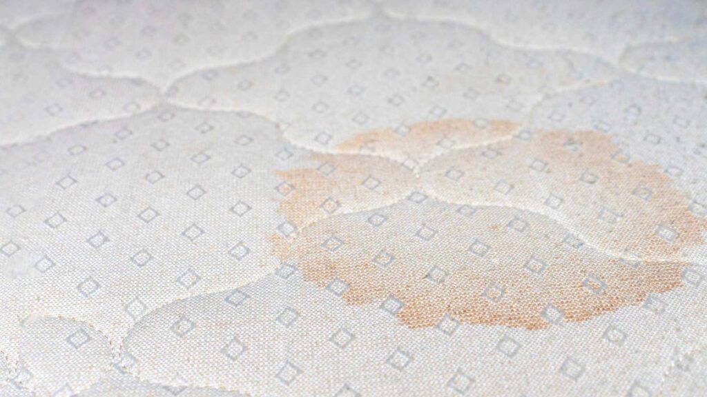 Cleaning stain off of mattress when child wets the bed.