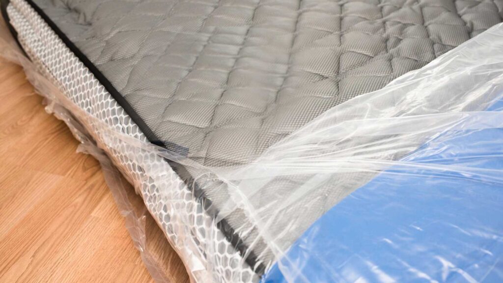 Cover mattress with plastic is how to haul a king size mattress in a pickup.