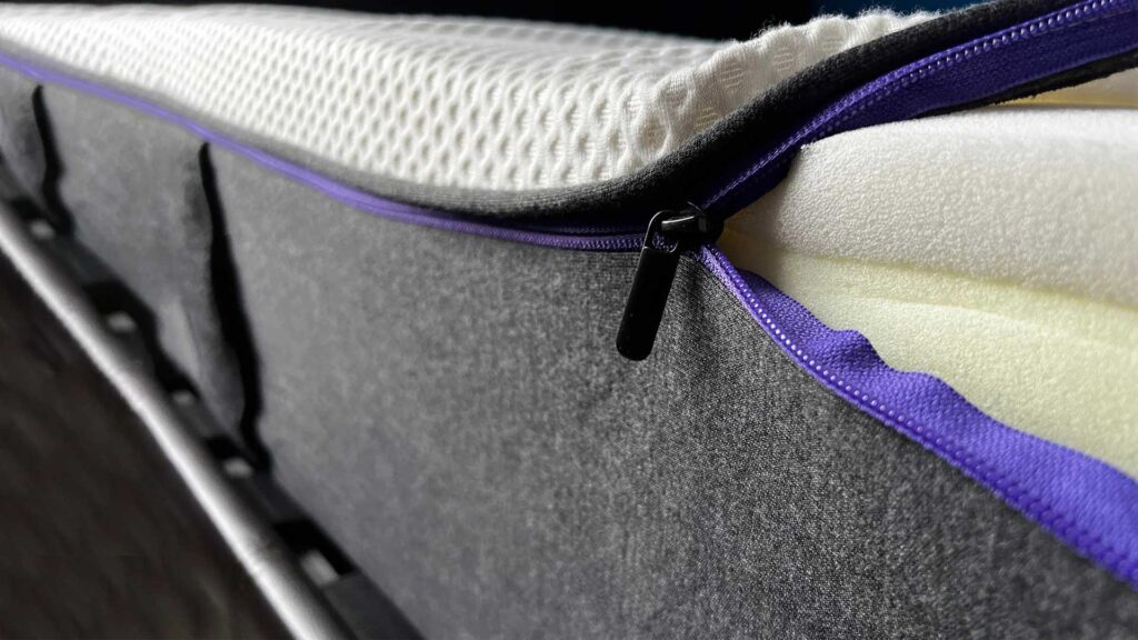 Dressing a mattress encasement.