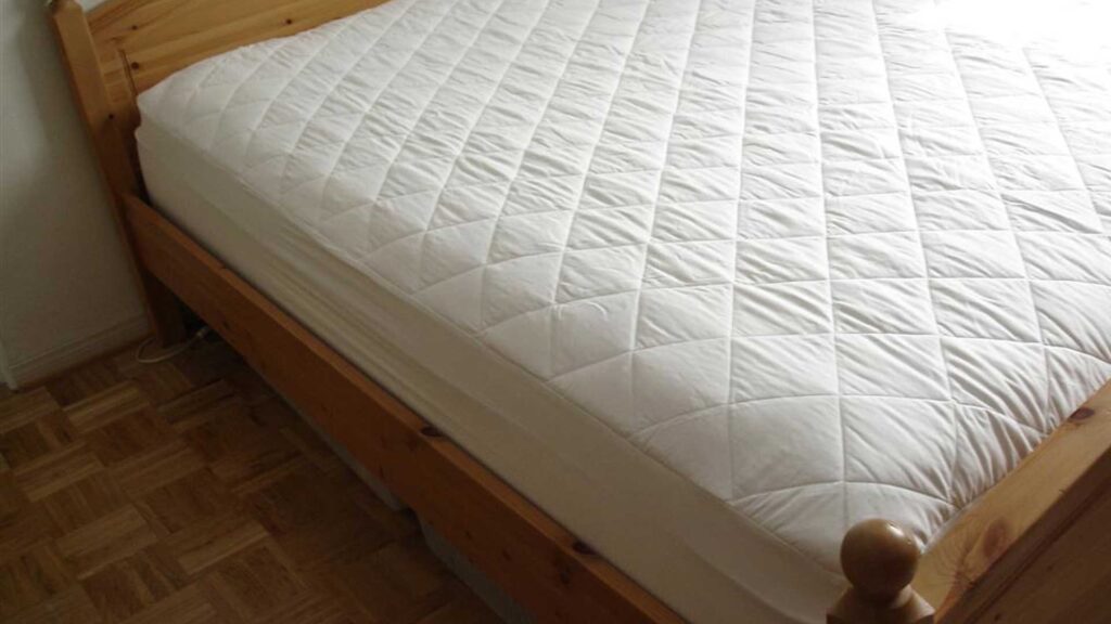 What is  a mattress pad that lays under the sheet.