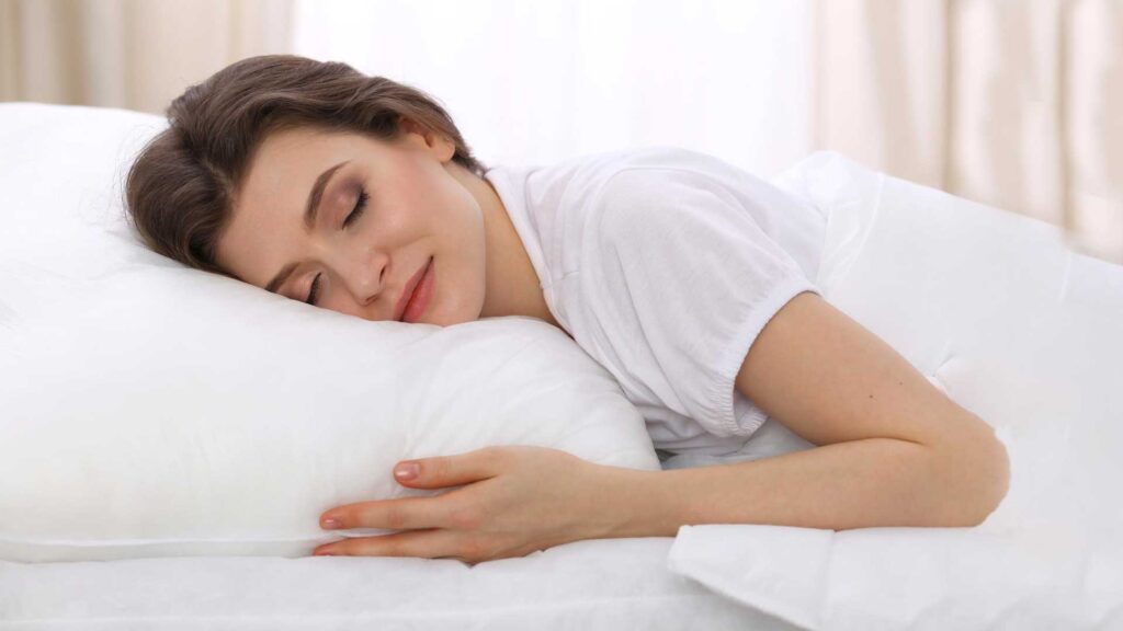 Using soft pillows is how to sleep on a hard mattress.