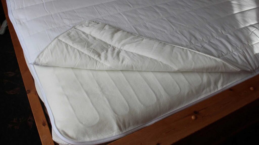 Using waterproof mattress protector if mattress takes long to dry.
