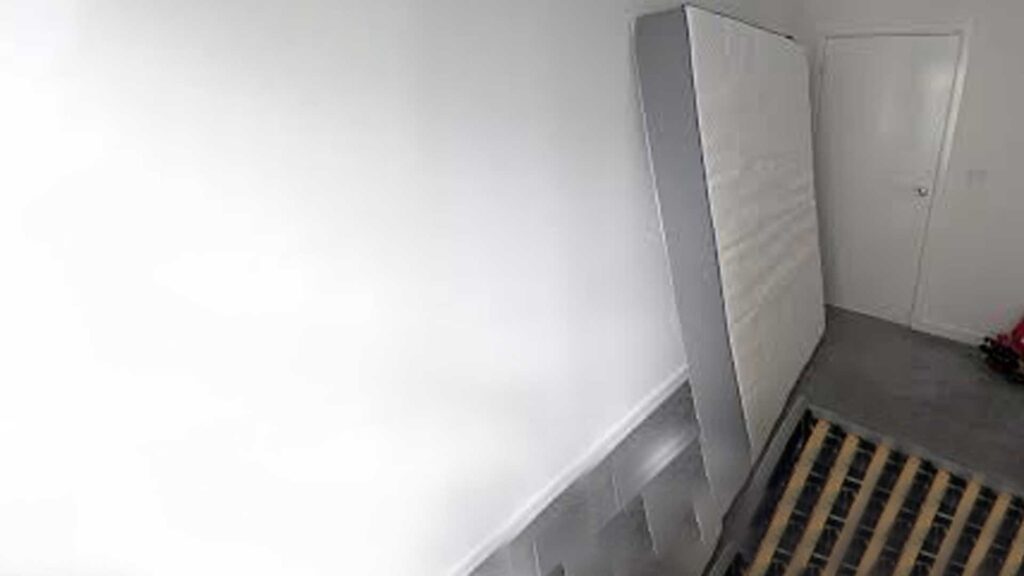Putting it vertically  to dry the mattress.